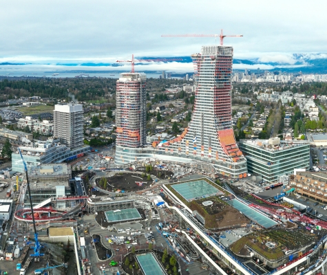 Oakridge residential towers under construction, with future park in the foreground and civic centre to the left.